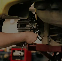 Mechanic working on a brake caliper