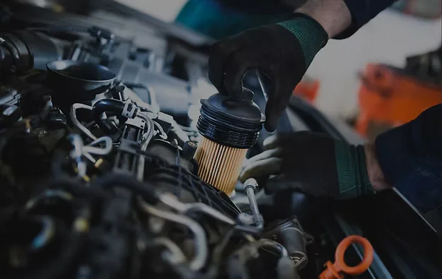 Mechanic changing an oil filter
